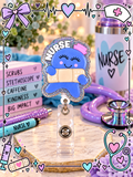 Cute blue nurse badge reel holding a bandage with pink cap and sparkling silver-toned border