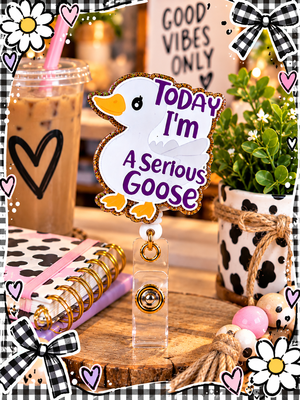 Serious Goose badge reel in a desk display with pastel pens