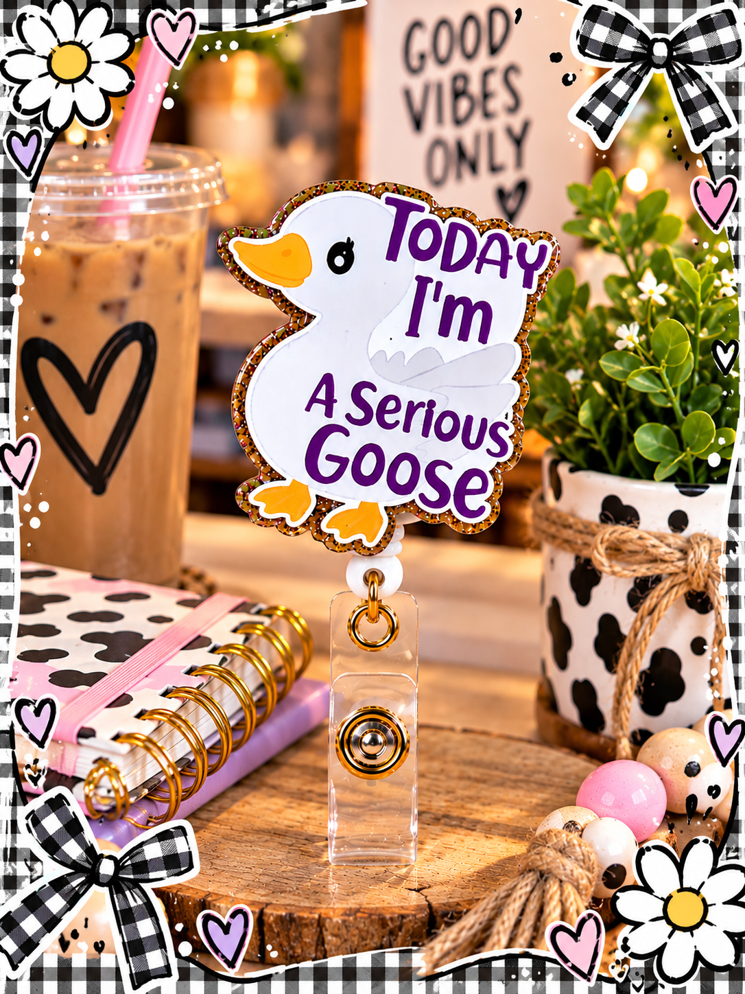 Serious Goose badge reel in a desk display with pastel pens