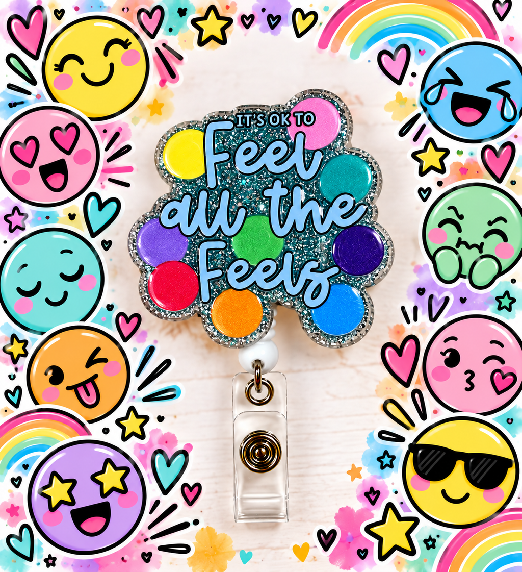 Colorful Feel All the Feels badge reel with clear snap strap on an encouraging desk display