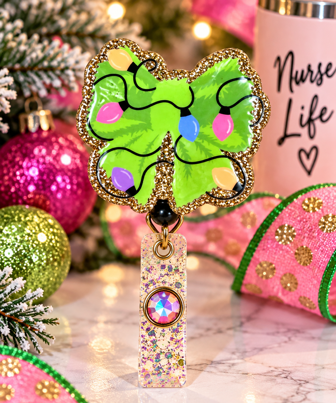Festive green bow badge reel with glitter strap and iridescent gem accent