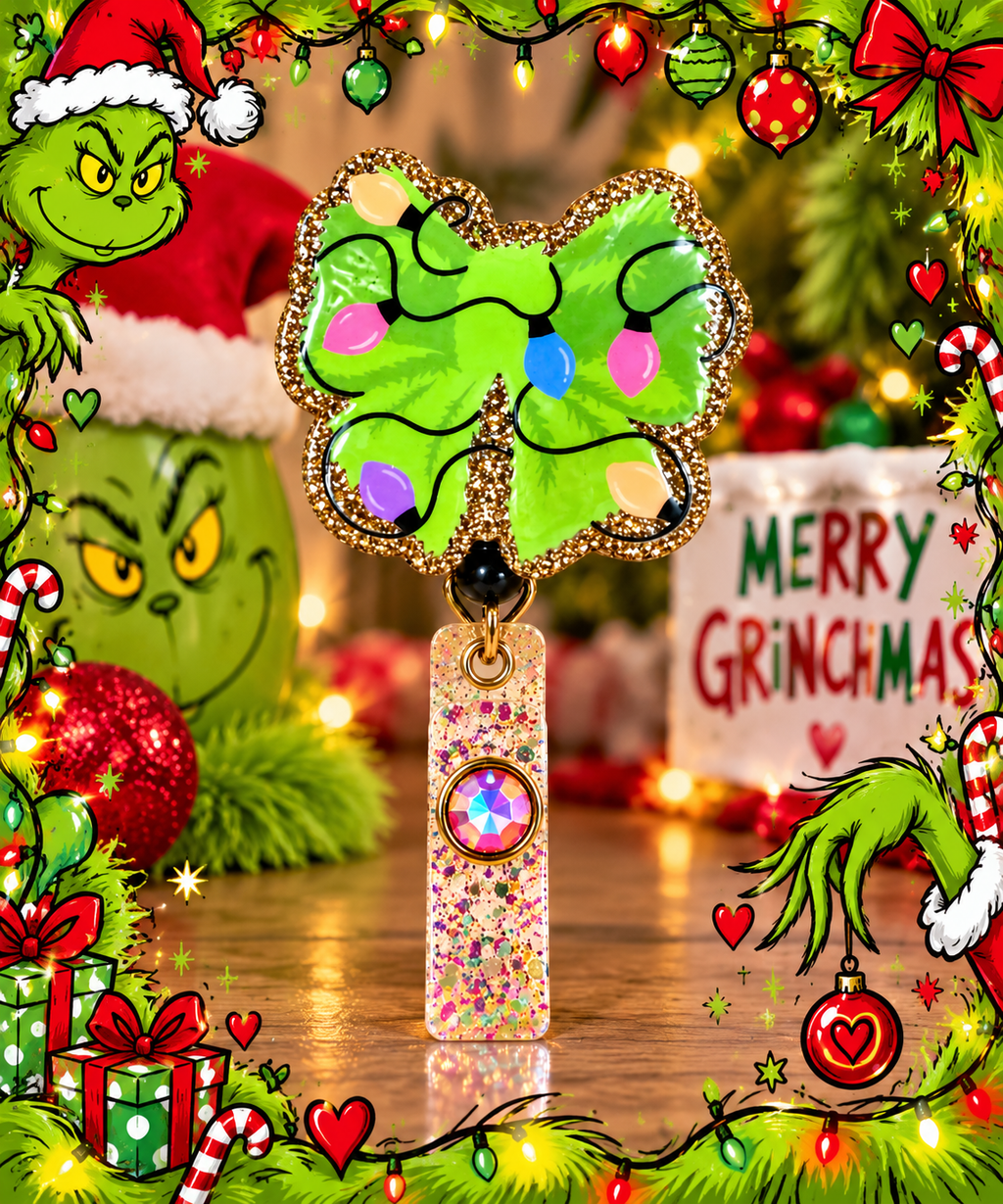 Close-up of green Christmas lights bow badge reel in a colorful holiday display