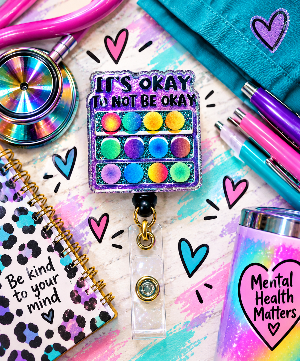 Close-up of It's Okay to Not Be Okay badge reel with colorful circles and iridescent sparkle