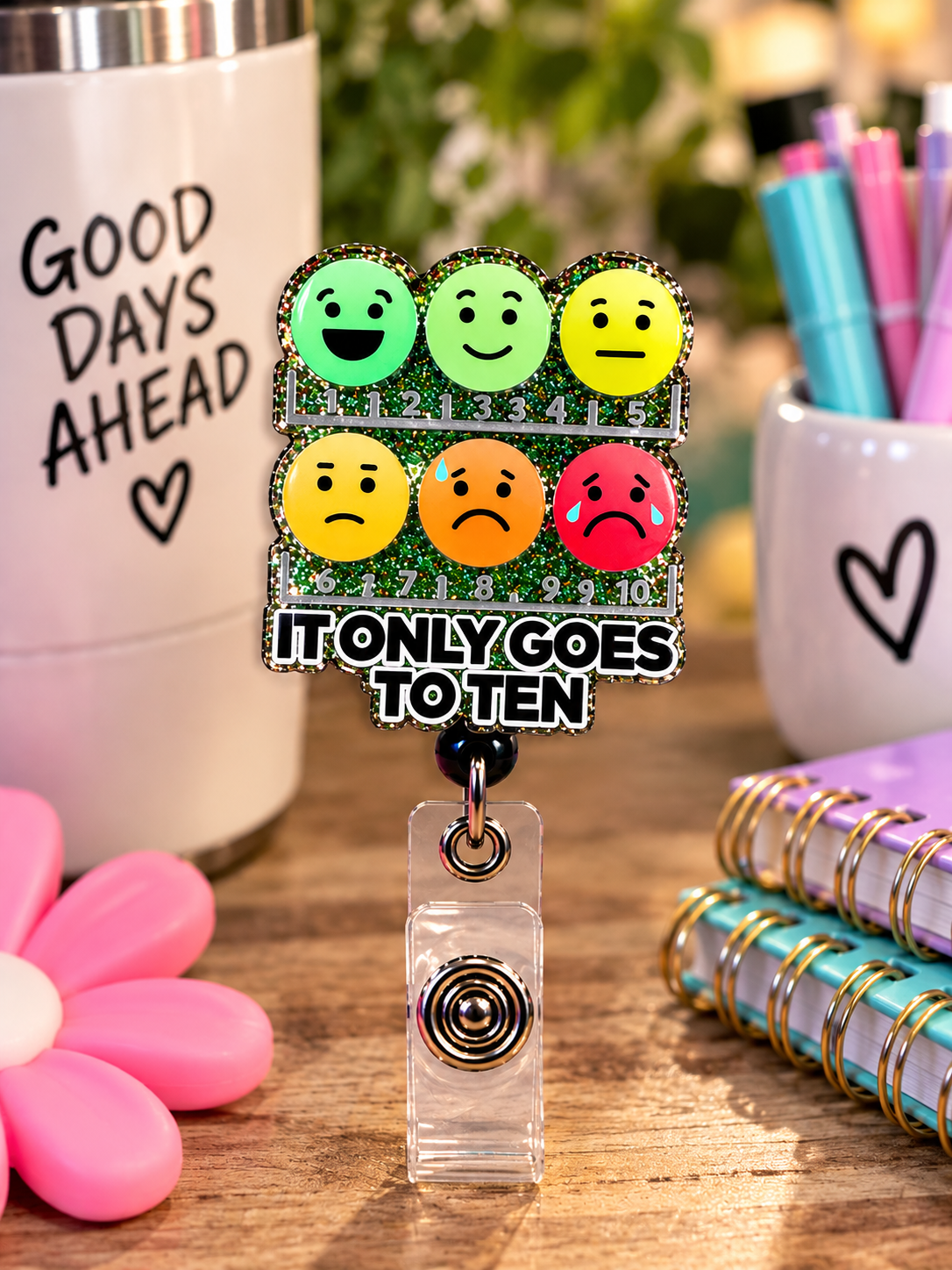 It Only Goes to Ten badge reel with clear snap strap beside radiology-themed props