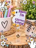 Today I'm a Serious Goose badge reel with purple lettering and gold glitter border